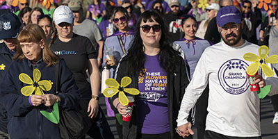 Walkers hold flowers