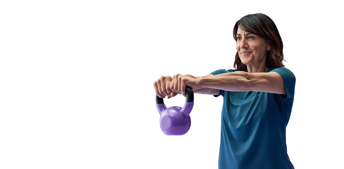 Woman swinging kettlebell