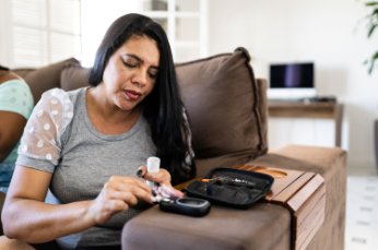 Woman checks her blood pressure