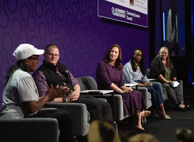 Brain health professionals speak on a panel at an Alzheimer's Association event.