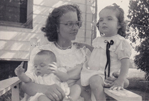 Carol (center) with Stella (right) and baby sister