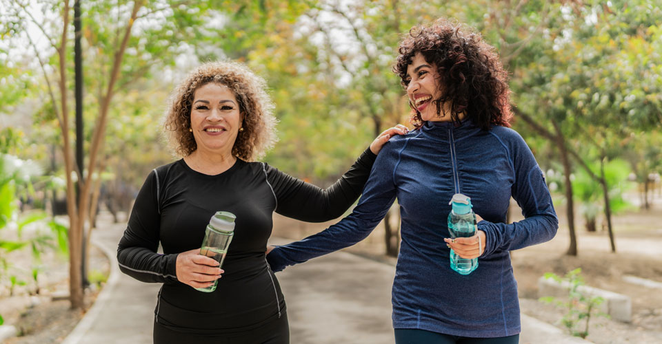 Two women walking outside.