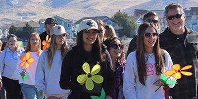 Walkers hold flowers