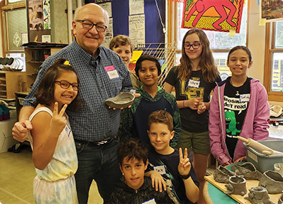 Chuck Costakos, living with Alzheimer's, connects with fourth-grade students once a week to create art and friendships.