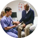Physician checking hand of patient